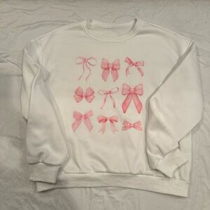 White Sweater with Pink Bow Design